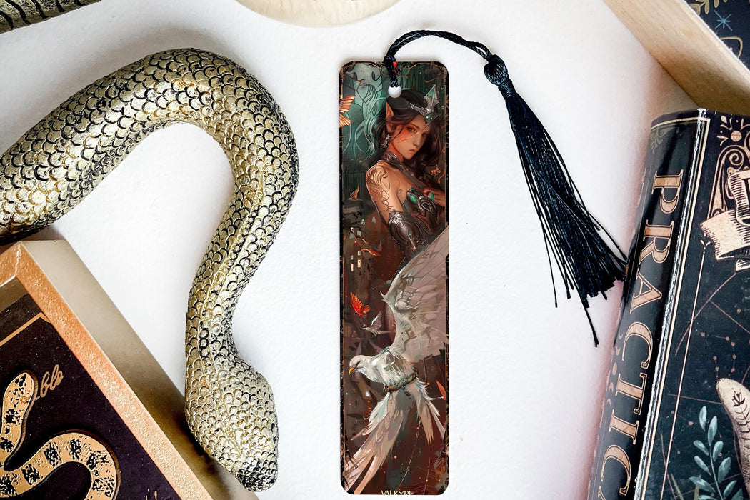 a bookmark with a picture of a woman and a snake on it
