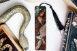 a bookmark with a picture of a woman and a snake on it