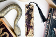 a bookmark, snake, and other items on a table