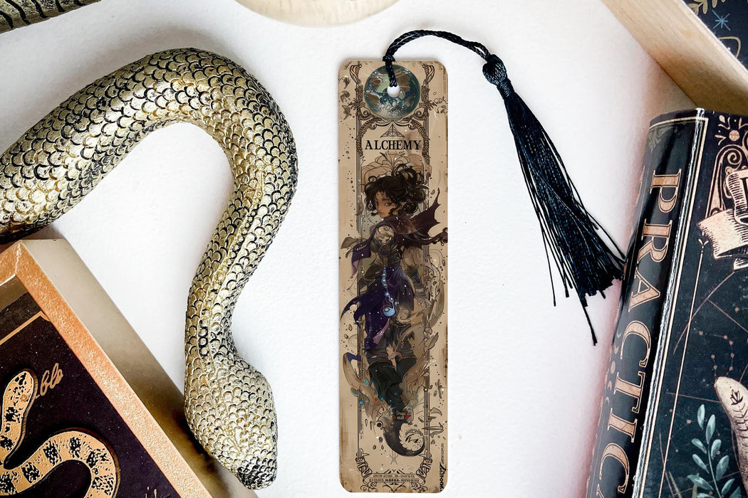 a bookmark, snake, and other items on a table