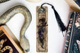 a bookmark, snake, and other items on a table