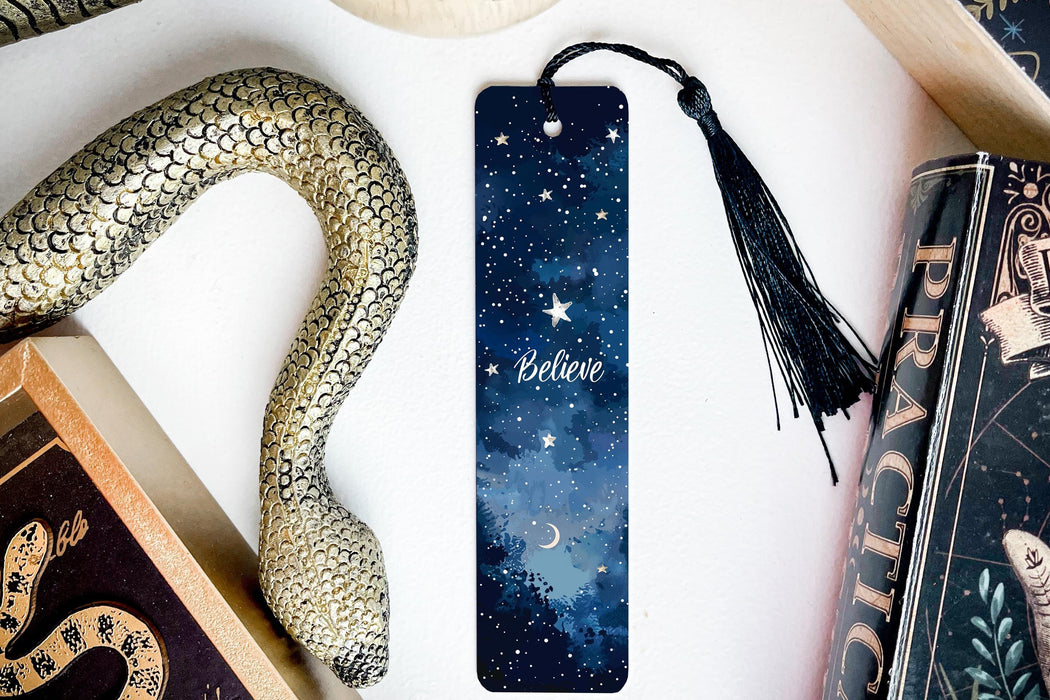 a bookmark, snake, and other items on a table