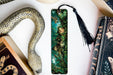 a bookmark with an image of a woman surrounded by snakes