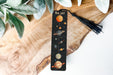 a bookmark with a picture of the solar system