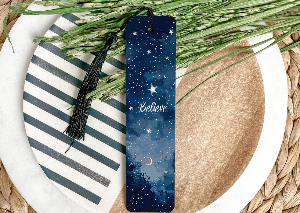 a bookmark with a name on it sitting on a plate