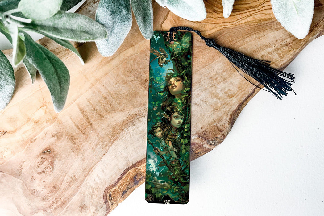 a green bookmark with a picture of a woman on it