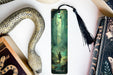 a bookmark with a picture of a man and a snake on it
