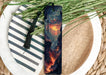 a bookmark with a picture of a volcano on it