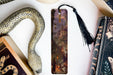 a bookmark, snake, and other items on a table