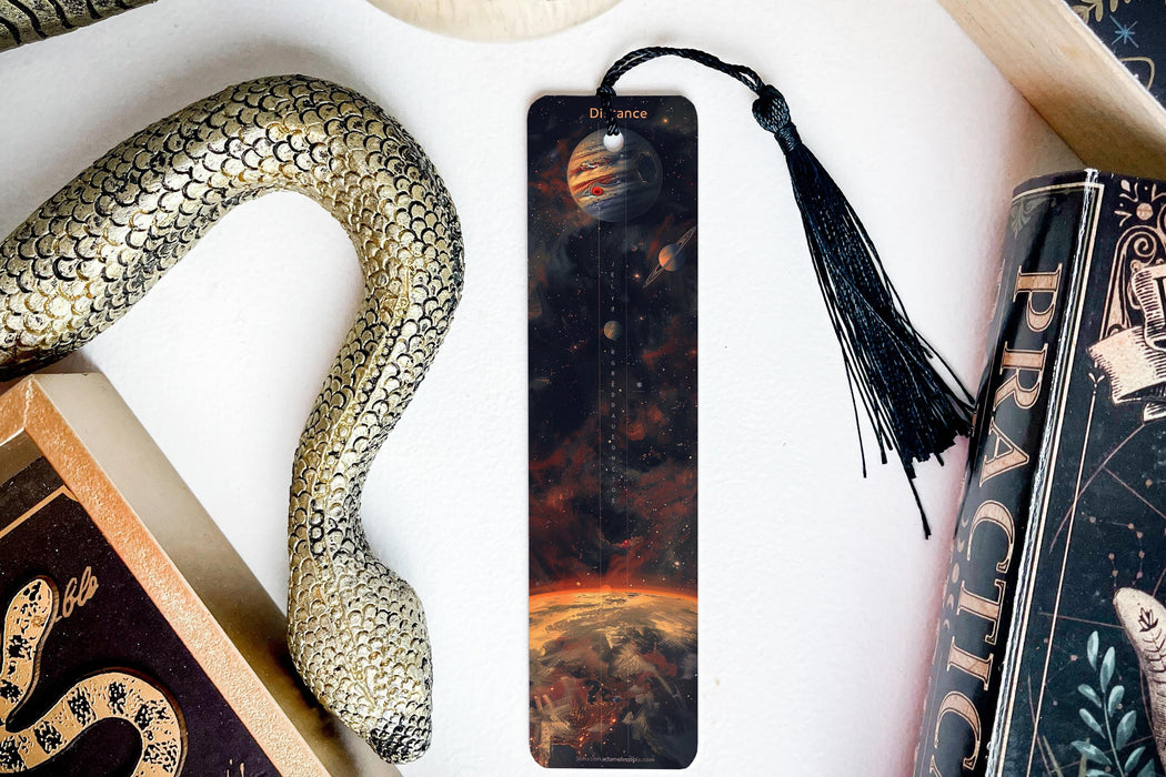 a bookmark, snake, and other items on a table