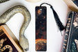 a bookmark, snake, and other items on a table