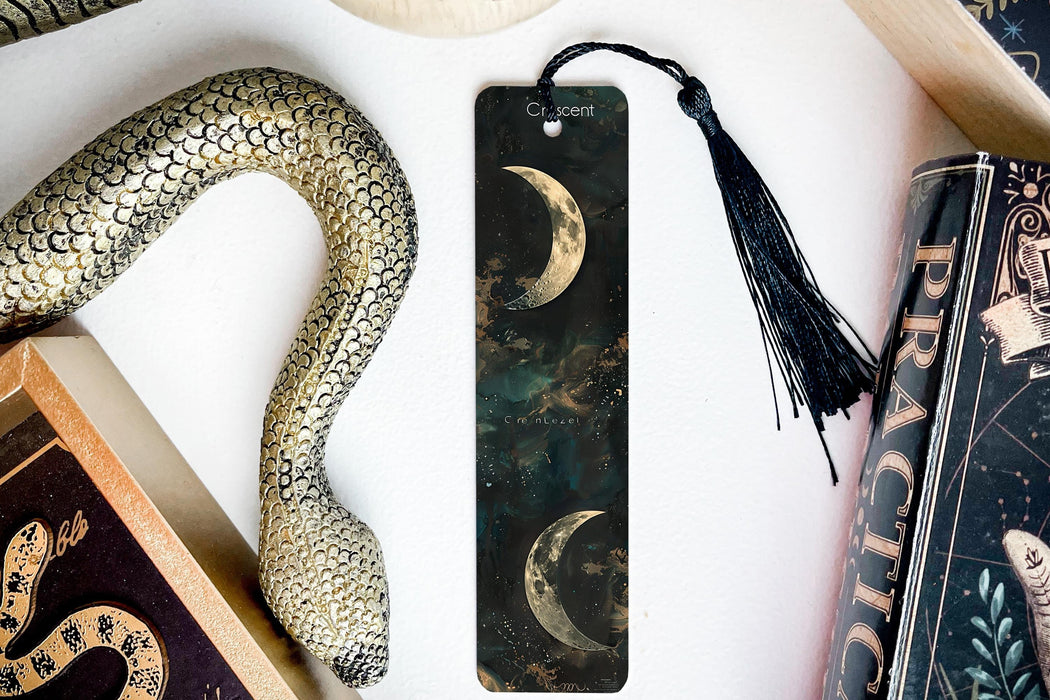a bookmark, snake, and other items on a table