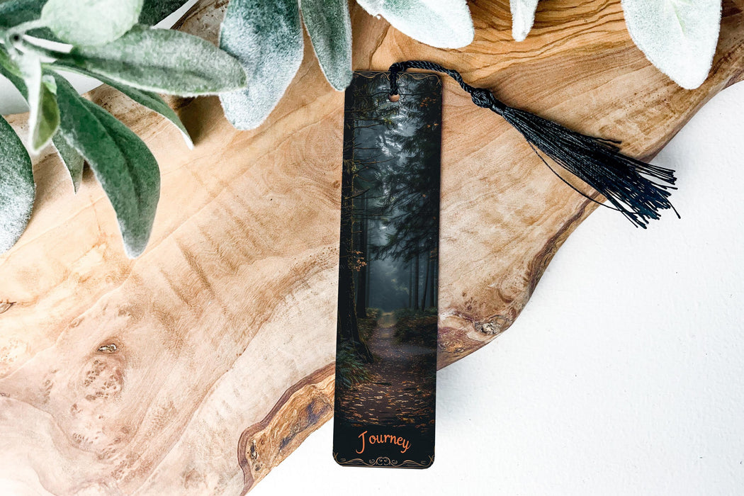 a bookmark with a forest scene on it