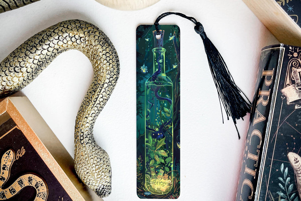 a bookmark, snake, and other items on a table