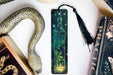 a bookmark, snake, and other items on a table
