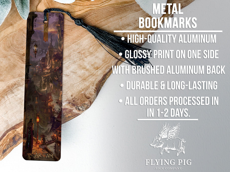 a metal bookmark with a tassel hanging from it