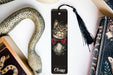a bookmark with a picture of a cat wearing a bow tie