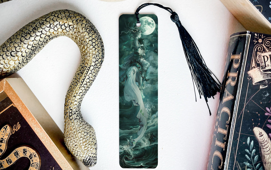 a bookmark with a picture of a woman and a snake on it