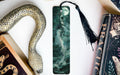a bookmark with a picture of a woman and a snake on it