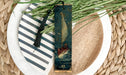 a close up of a plate with a bookmark