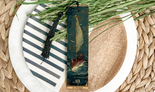 a close up of a plate with a bookmark