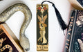 a bookmark with an image of a woman and a snake on it