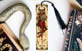 a bookmark, snake, and other books on a table