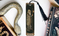 a bookmark with a picture of a wizard next to a snake