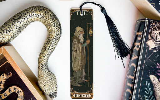 a bookmark with a picture of a wizard next to a snake
