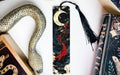 a bookmark with a snake and a book on it