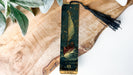 a bookmark with a picture of a sailboat on it