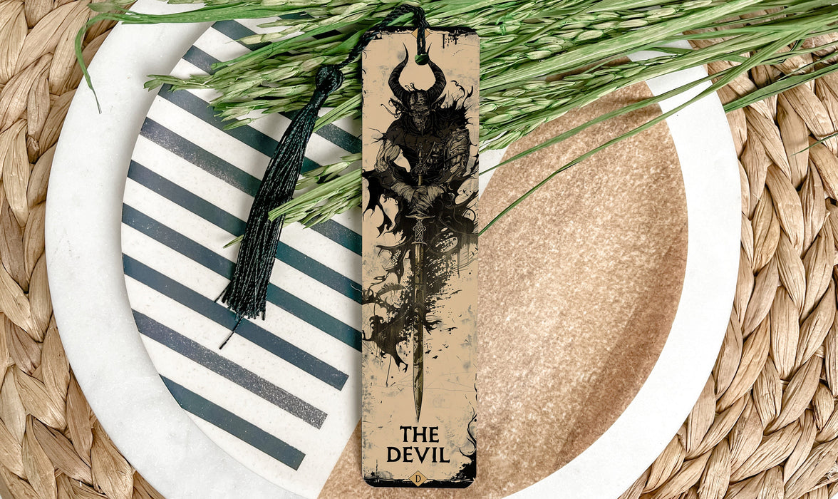 a bookmark with a picture of a demon on it