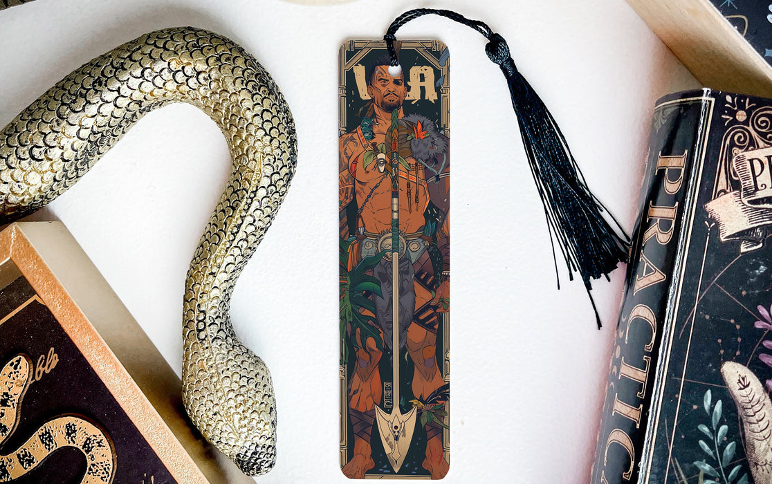 a snake, a bookmark, and some books on a table
