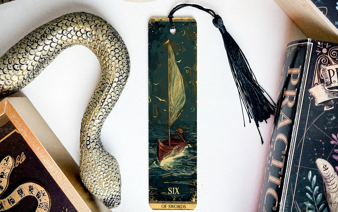 a bookmark with a snake and a boat on it