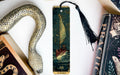 a bookmark with a snake and a boat on it