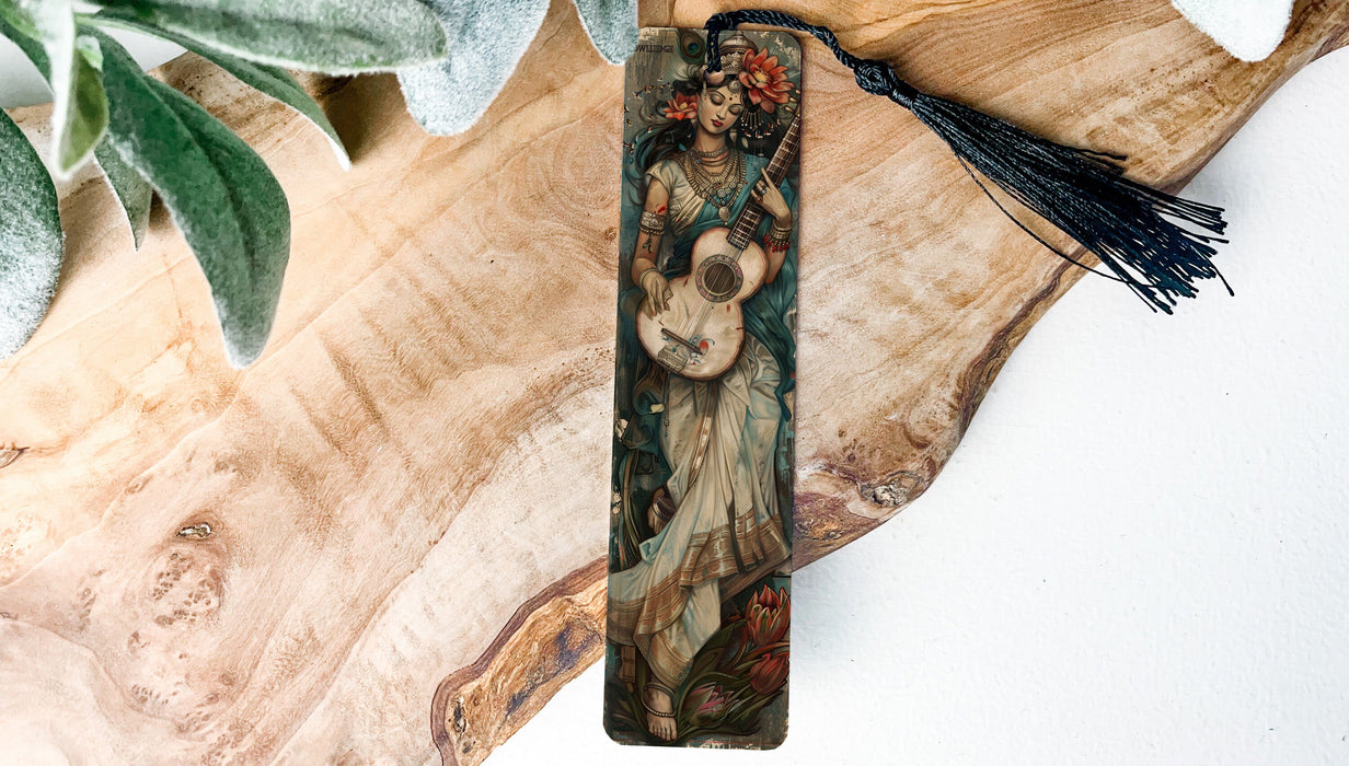 a bookmark with a painting of a woman holding a baby