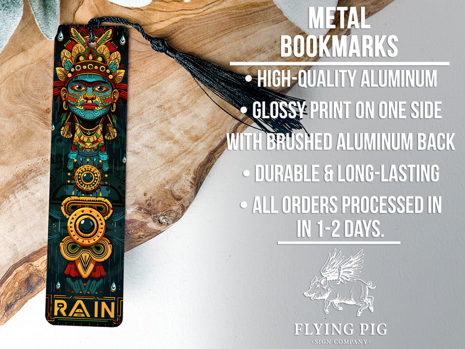 a metal bookmark with a tassel on top of it