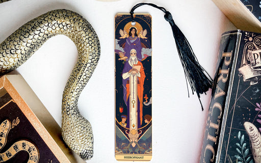 a bookmark with an image of the virgin mary and a snake