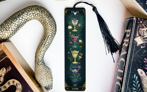 a book with a bookmark and a snake next to it