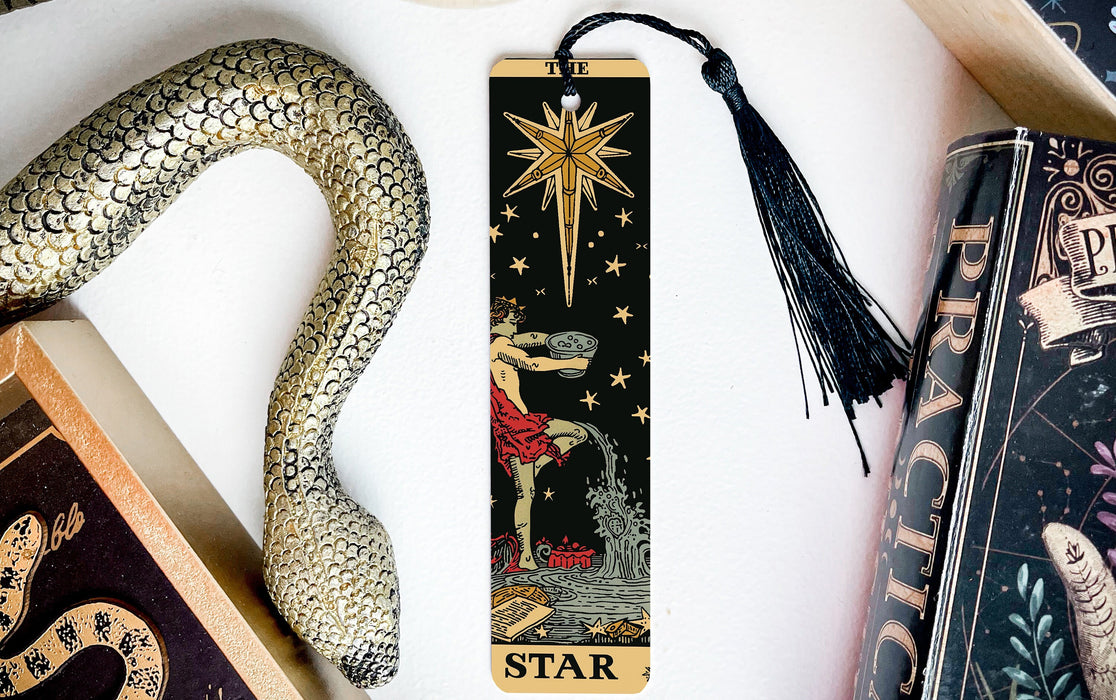 a bookmark with a snake and a star on it