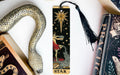a bookmark with a snake and a star on it