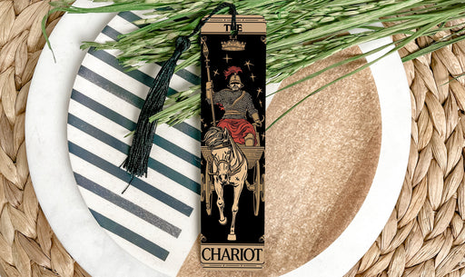 a bookmark with a picture of a skeleton riding a horse