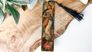 a bookmark with a painting of a woman on it