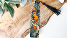a bookmark with a picture of a dragon on it