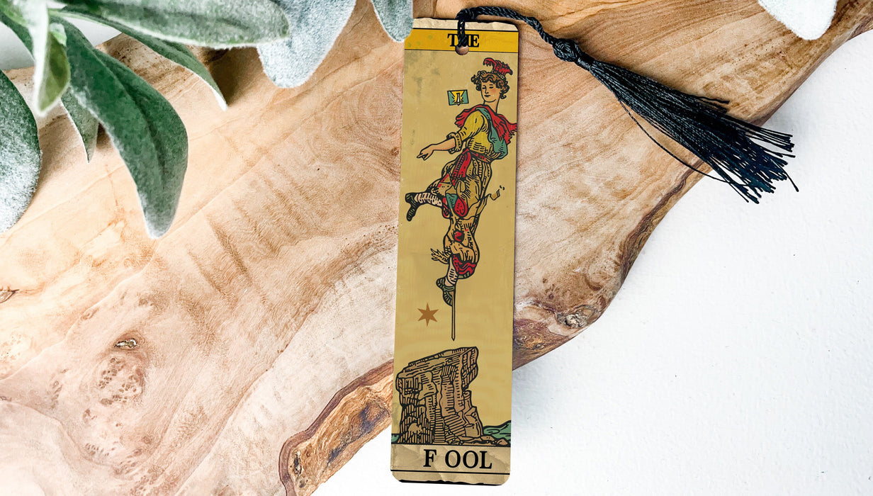 a wooden bookmark with a picture of a woman on it