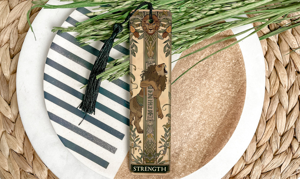 a plate with a bookmark and a plant on it