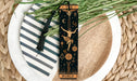 a bookmark with a design on it sitting on a plate
