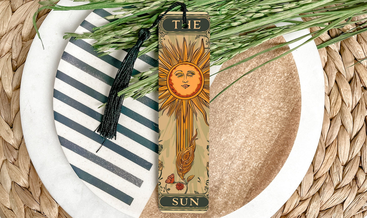 a bookmark with a picture of a sun on it