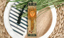 a bookmark with a picture of a sun on it