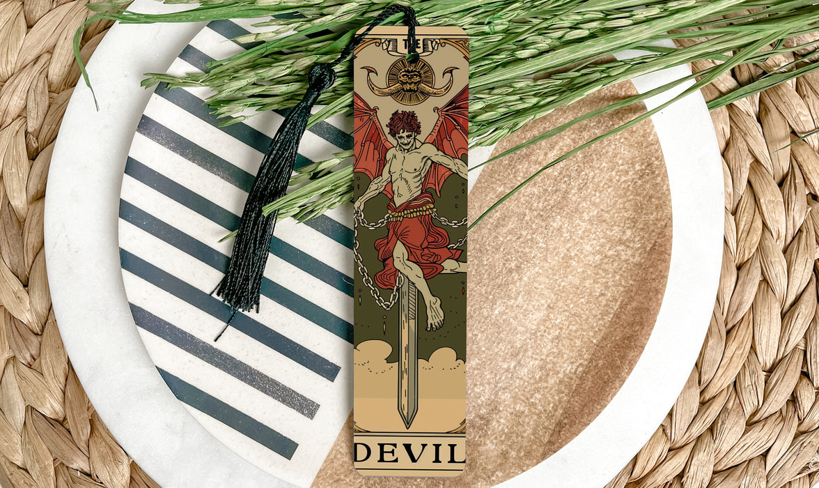 a bookmark with a picture of a devil on it